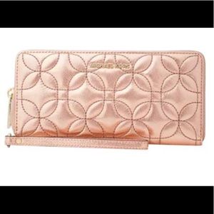 MK quilted floral travel continental wallet